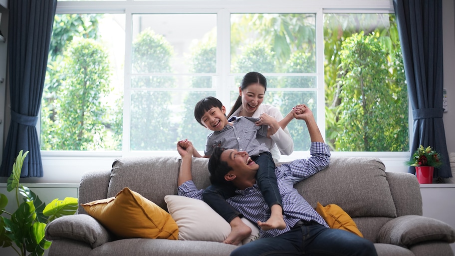 family in living room with lots of natural light 